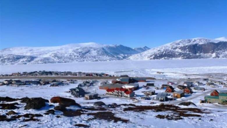 Image of a snowy community in the mountains.