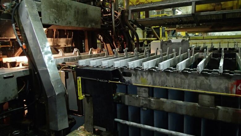 Metal machinery is seen inside a zinc mine.