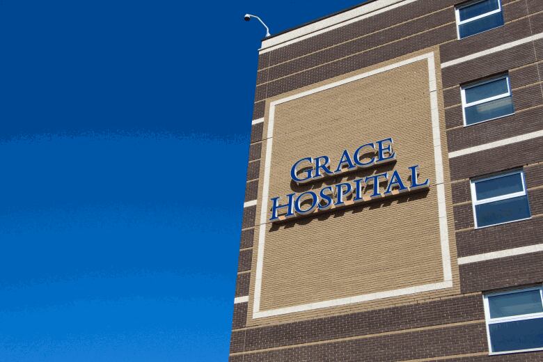 Side of a brick building with the words Grace Hospital