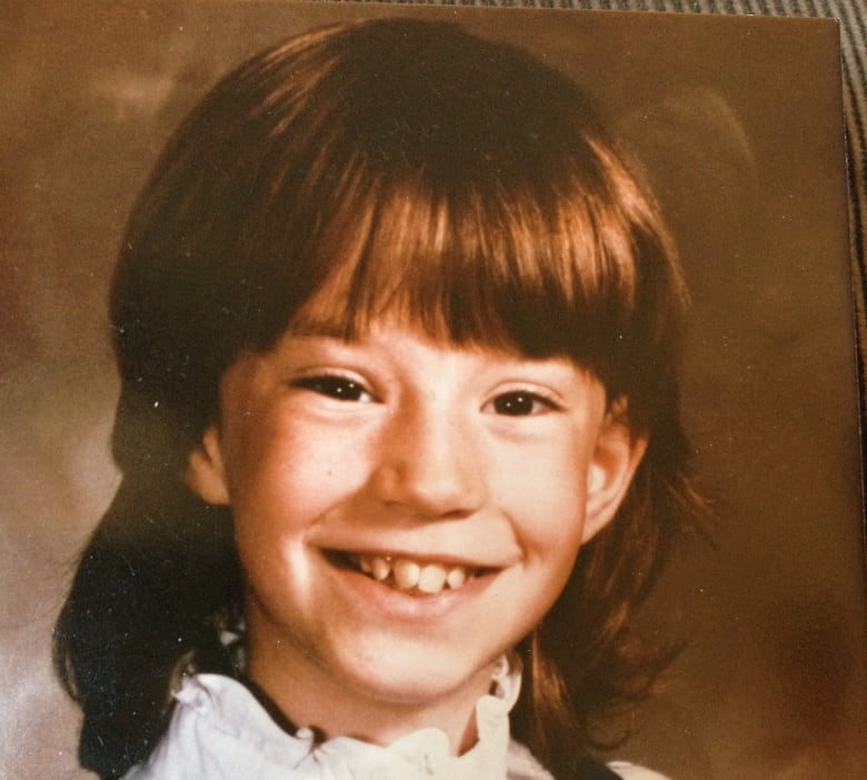 School picture of a little girl in the 1980s.