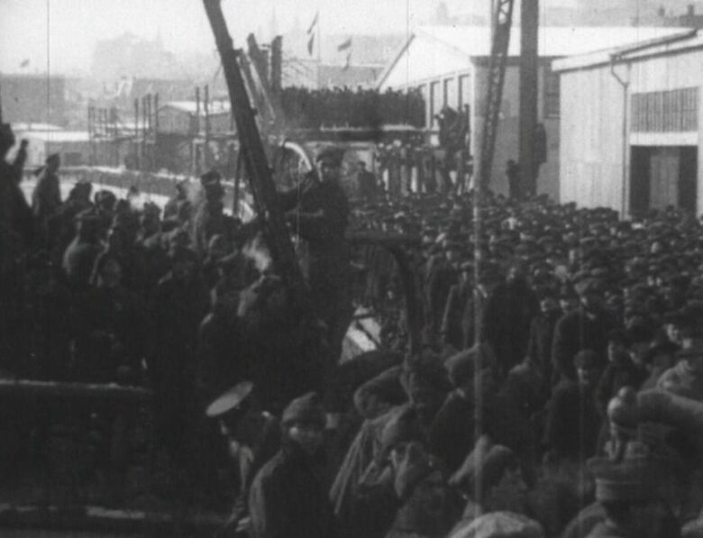 Men and boys gathered as they get ready to fight in the war.