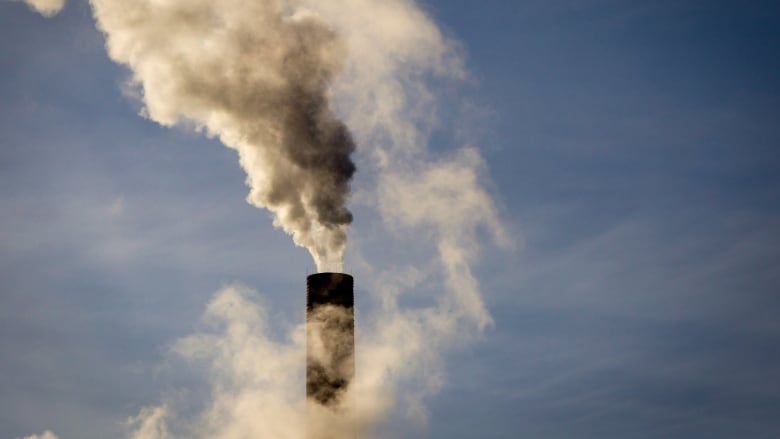 Smokestack coming out of a chimney. 