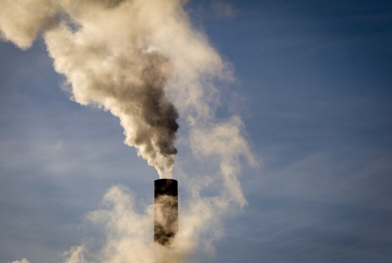 Smokestack coming out of a chimney. 