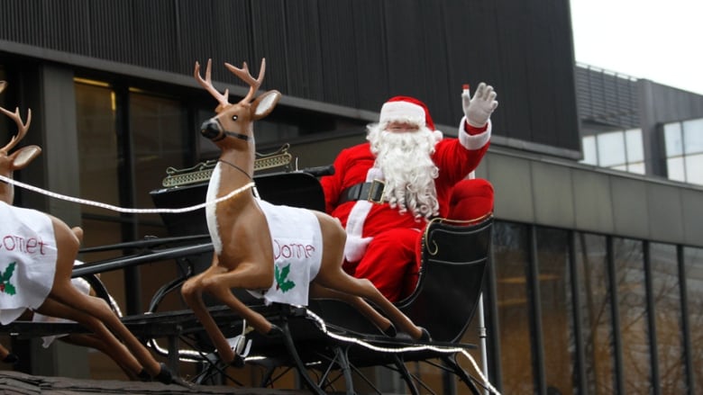 Santa sitting in his sleigh.