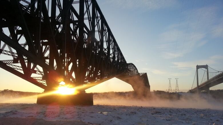 A bridge with a sunflare