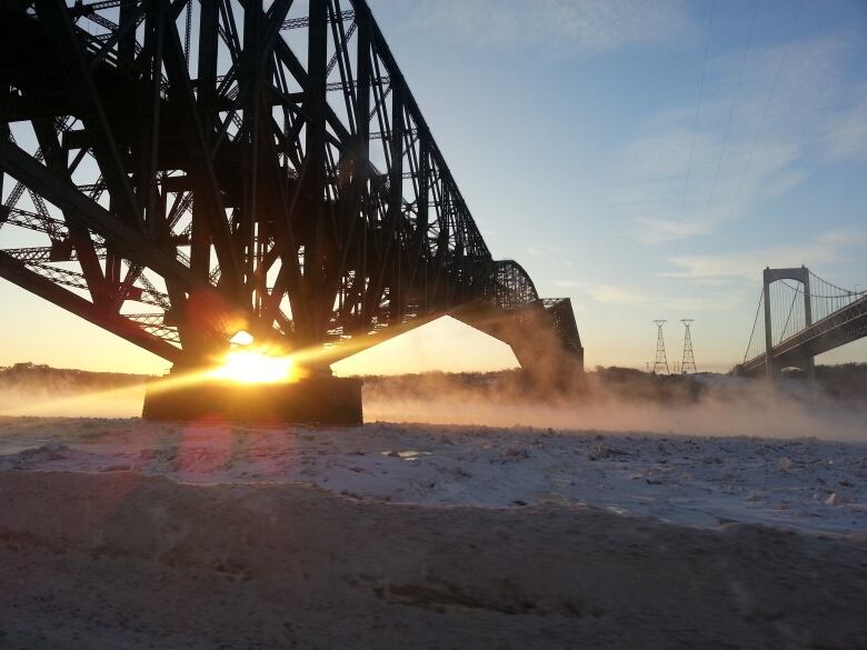 A bridge with a sunflare