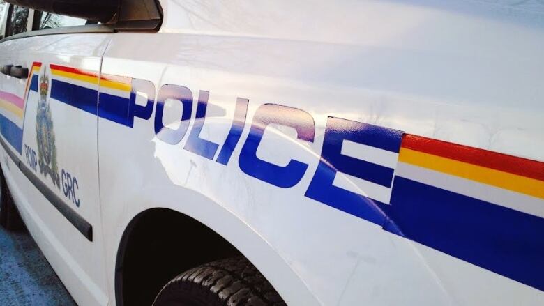 The front end of an RCMP vehicle shows a 'police' decal on the front ride fender.