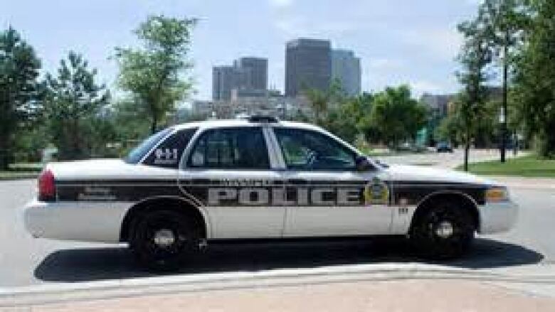 A Winnipeg Police vehicle is pictured parked by a curb.