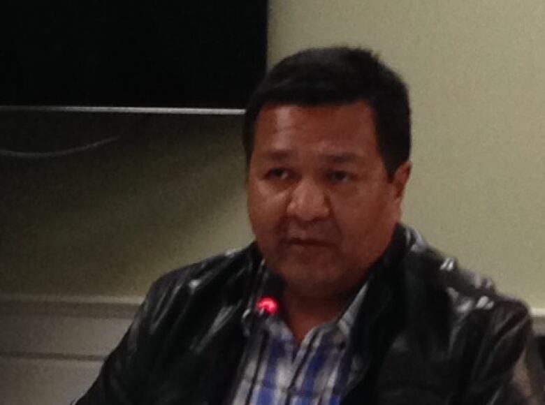 Head shot of Bruce Achneepineskum sitting at a table as part of a panel discussion.