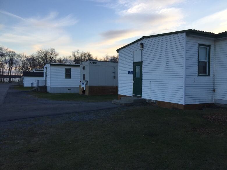 A row of while prefab houses.