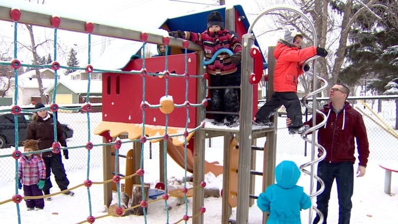 Children play on equipment outside an Edmonton daycare. 