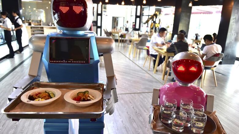 Automated restaurants like this one in China are springing up around the world. An government sponsored exhibition of mechanized food service could put Canada on the map.