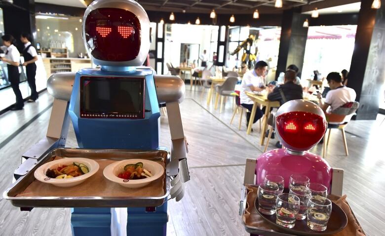 Automated restaurants like this one in China are springing up around the world. An government sponsored exhibition of mechanized food service could put Canada on the map.