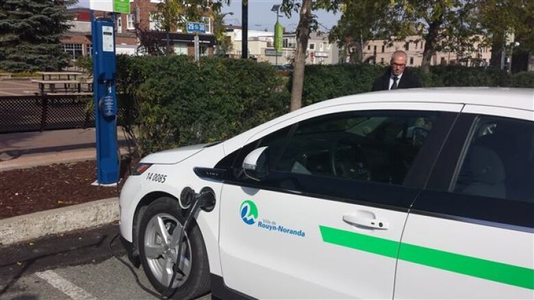 parked electric car at a charging station