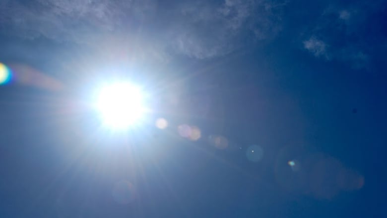 A closeup of the sun against a clear blue sky.