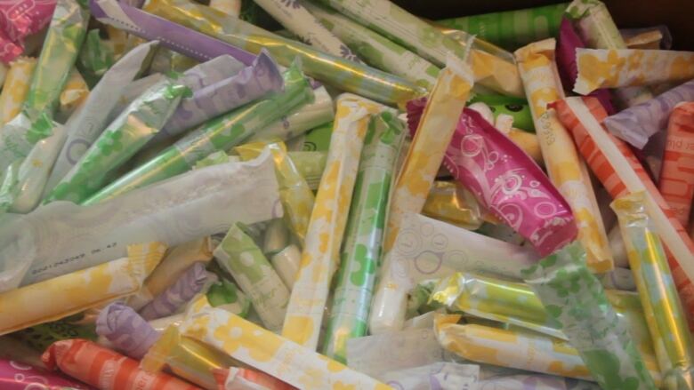 A close-up shot of colourfully-wrapped tampons