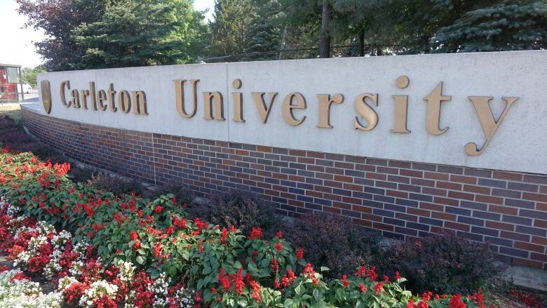 A sign for Carleton University at a campus entrance.