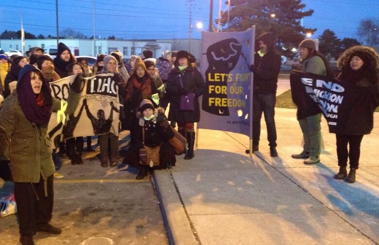 About 150 people including former detainees and family members of some of those currently detained gathered outside the medium-security facility on International Human Rights Day calling for a no more than 90-day limit to detentions as a first step to ending them completely