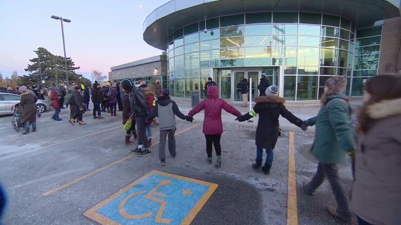 About 150 people including former detainees and family members of some of those currently detained called for a no more than 90-day limit to detentions as a first step to ending them completely.