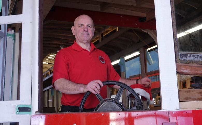 Rheaume Laplante, the coordinator of the long-gestating Streetcar 696 Restoration Project, is an OC Transpo retiree. He's pictured here with the streetcar replica in 2017.  