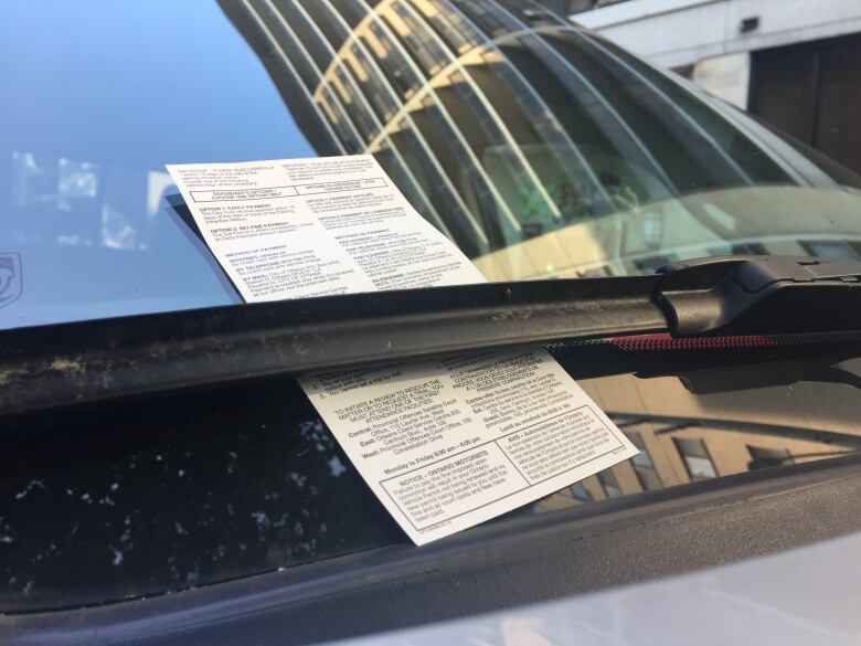 Ticket under a windshield wiper