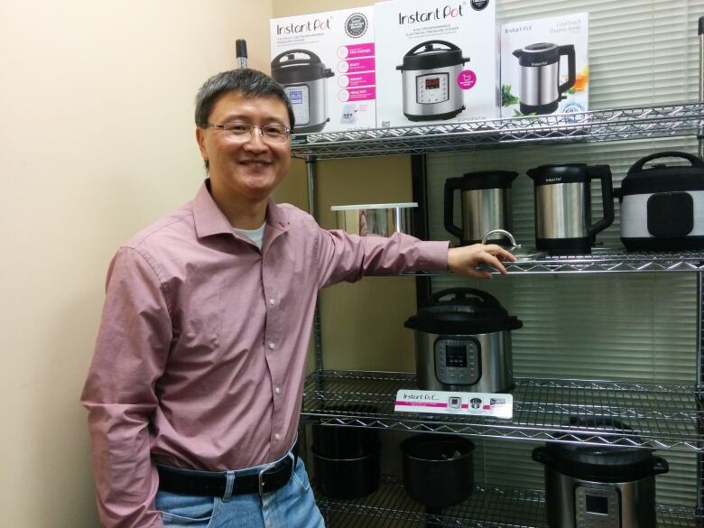 Instant Pot inventor Robert Wang is shown with the device he created.