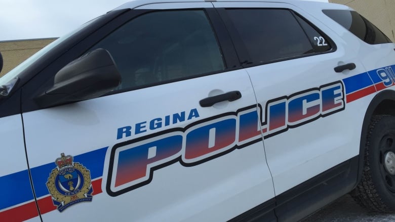 The side of a police cruiser that says Regina Police is shown