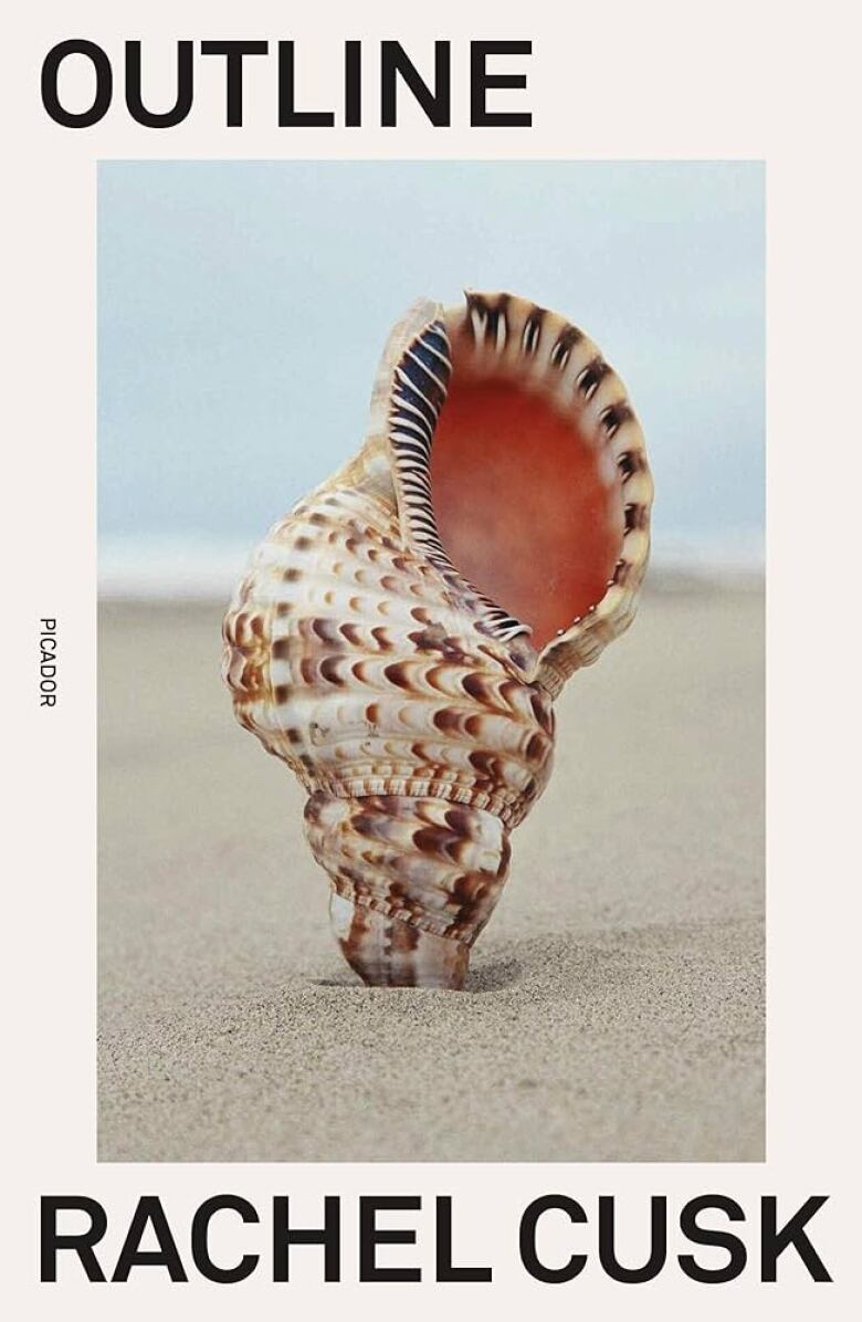 A book cover of a conch shell sticking up in the sand. 