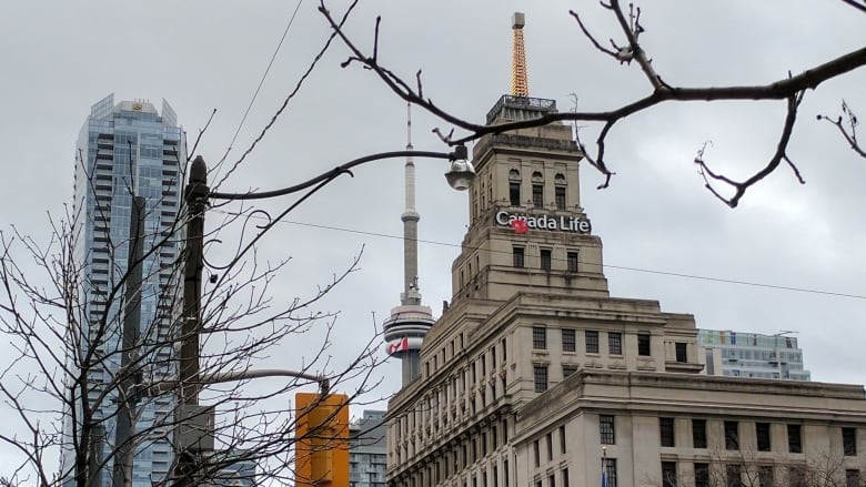 A downtown scene with a historic-looking building in the foreground.