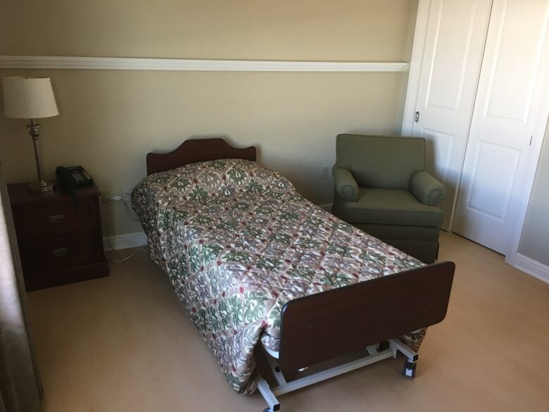 An empty long-term care bed.