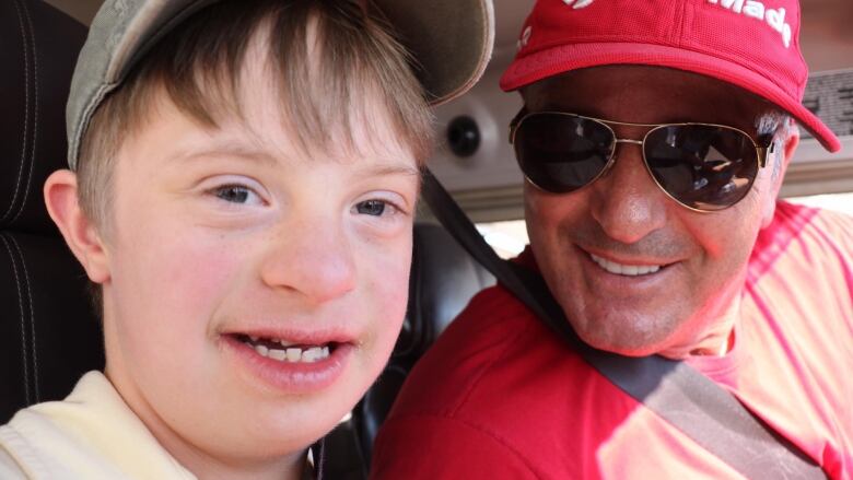 Dimitri Neonakis is shown at the controls of his plane. His passenger is 13-year-old Billy Holt.