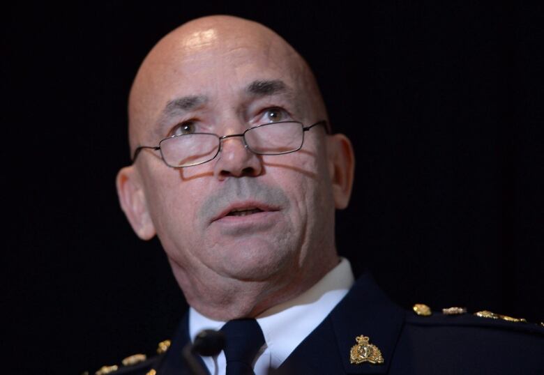 RCMP commissioner Bob Paulson speaks during a new conference in in Ottawa on Thursday, Oct. 6, 2016. Paulson has apologized to hundreds of current and former female officers and employees for alleged incidents of bullying, discrimination and harassment.