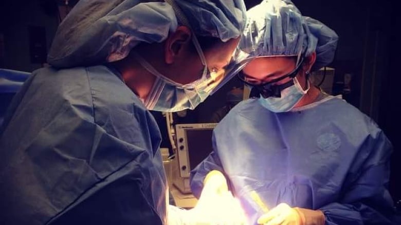 Two doctors in an operating room. 