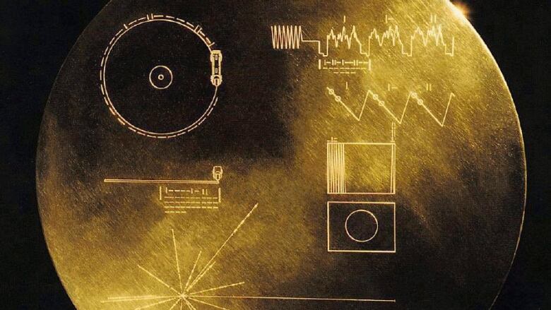 A close up image of the Voyager record shows some diagrams on the front as a time capsule.