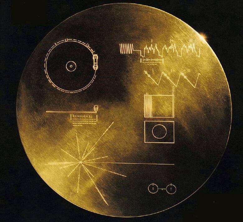 A close up image of the Voyager record shows some diagrams on the front as a time capsule.