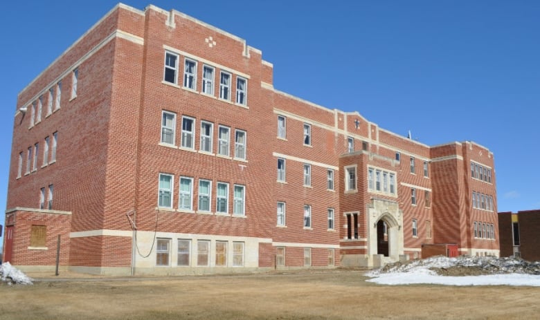 A large red brick building. 