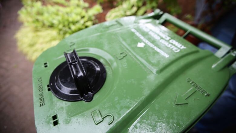 Close up of a green bin lid. 