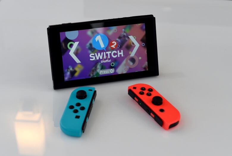 A Nintendo Switch is displayed on a table.