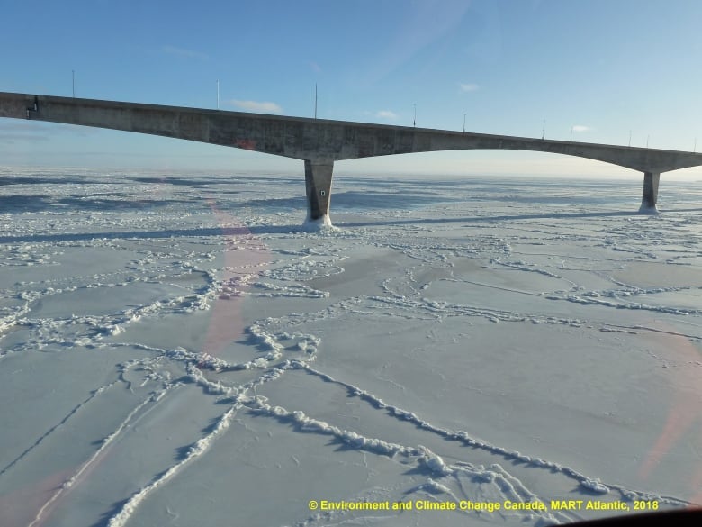 Confederation Bridge with ice covering the Northumberland Strait.