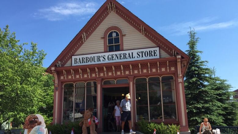 A small wooden structure that was a school house converted to a general store. 