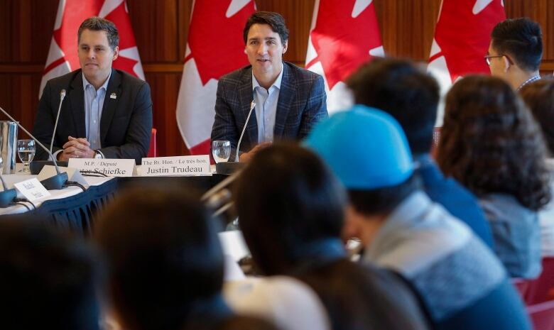 Prime Minister Justin Trudeau, centre, attends a meeting of the Prime Minister's Youth Council in Calgary on Wednesday, Jan. 25, 2017.