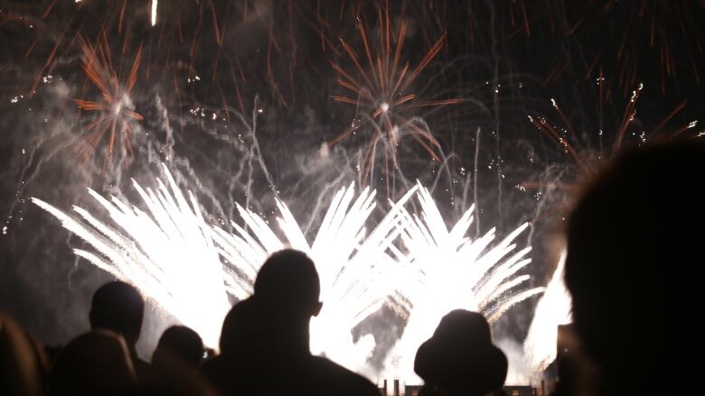 People look at fireworks