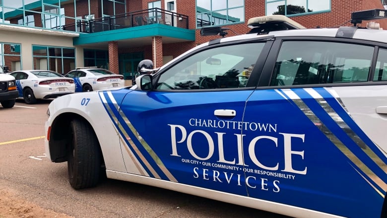 A branded police cruiser is parked outside the Charlottetown Police Services station.