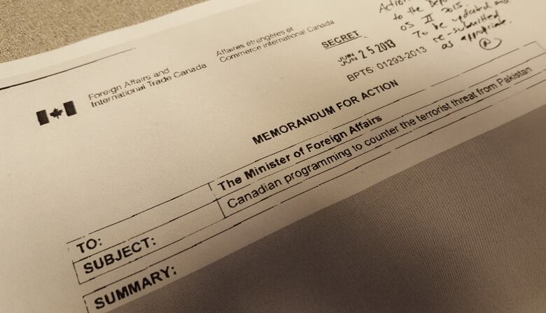 This memo marked 'secret,' dated June 25, 2013, titled 'Canadian programming to counter the terrorist threat from Pakistan' was among the documents obtained by The Fifth Estate through access to information requests into Canada's ban on adoptions from Pakistan. Virtually all of it is redacted.