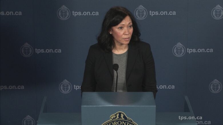 Deputy Toronto Police Chief Lauren Pogue standing at podium at police headquarters.