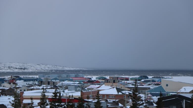 A winter view of a town in northern Quebec from a hill top.