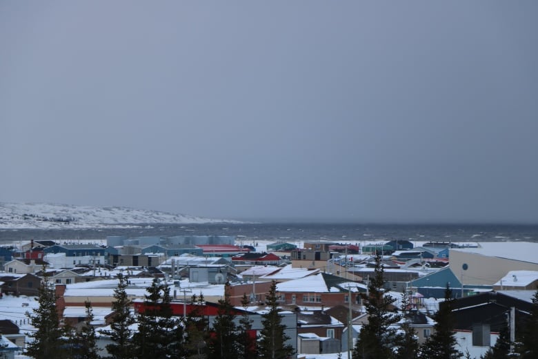 A winter view of a town in northern Quebec from a hill top.