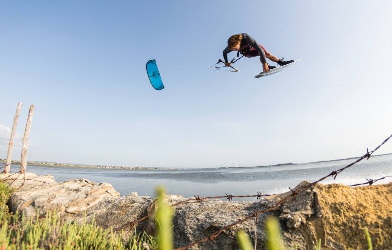 Lucas Arsenault airborne while kiteboarding off the shore of P.E.I.