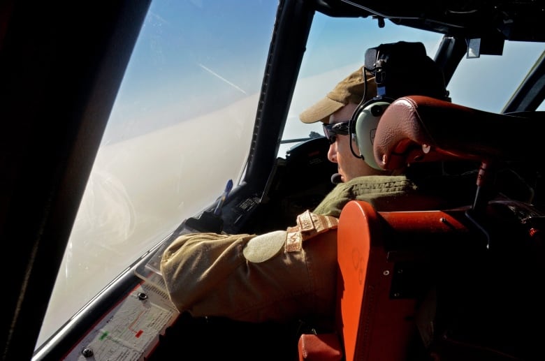 A Canadian CP-140 Aurora pilot looks over the Libyan coast during a surveillance mission on July 25, 2011. Aurora surveillance planes recently started broadcasting propaganda messages aimed at convincing forces loyal to dictator Moammar Gadhafi to give up and go home.