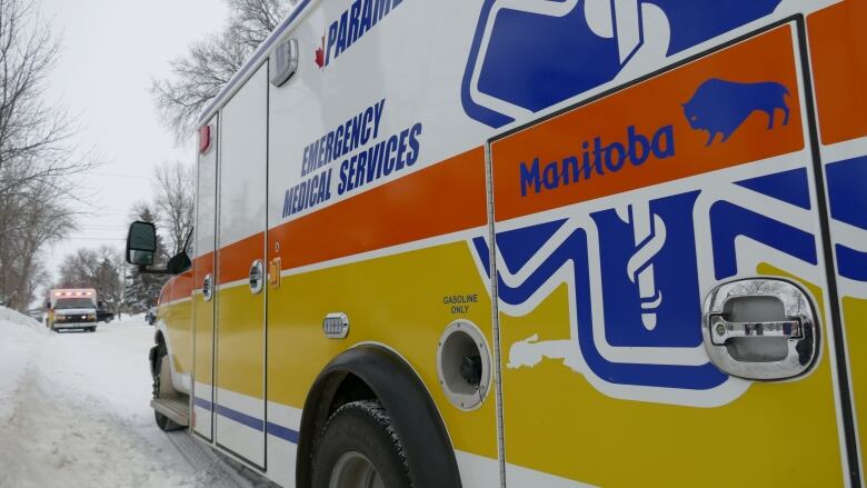 Brandon Manitoba EMS Ambulance parked on snowy road.